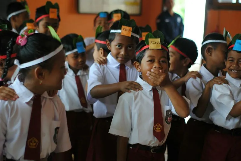 Abu Dhabi Schools For Expats where diverse students engage in a fun group activity and build friendships in a school environment.