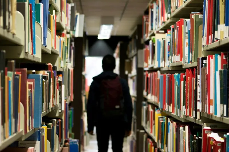 Transition To Middle School with a student exploring a library and preparing for new learning experiences in a larger academic environment.